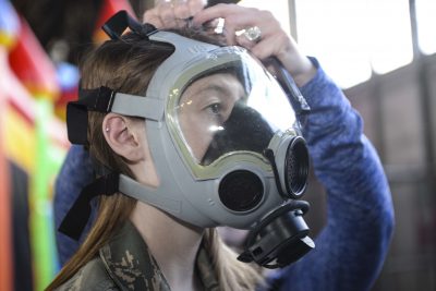 Girl Wearing Military Gas Mask 